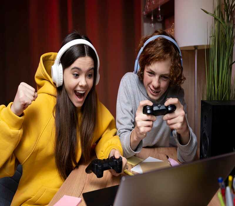 two teenagers playing a video game like NTLGamerz Blog